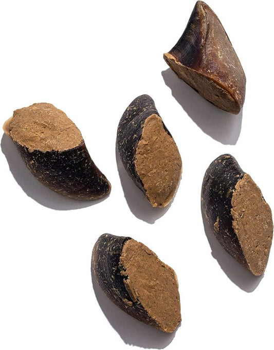 Five cow hooves stuffed with bacon and cheese flavored substance on a white background.