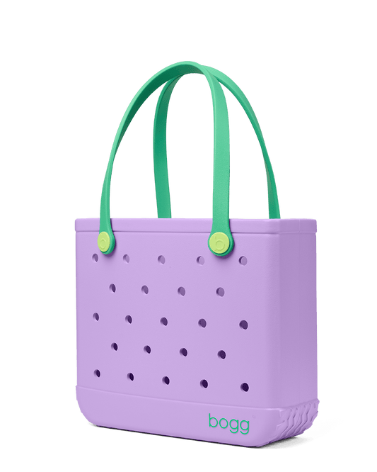 Purple Baby Bogg tote bag with green handles on a transparent background