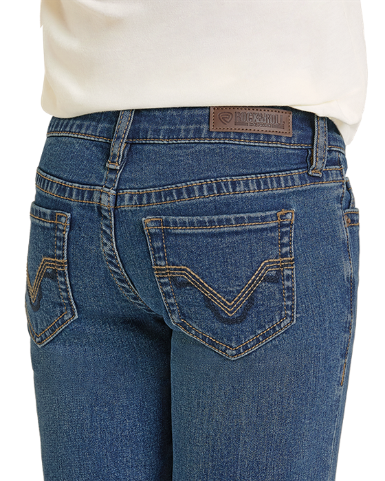 Blue jeans with a brand logo on the back pocket against a white background