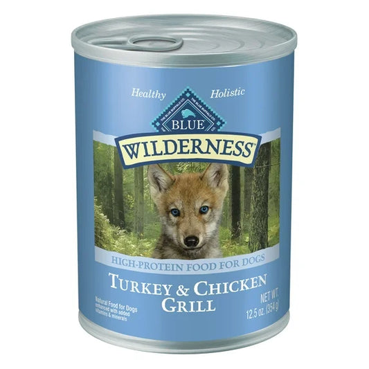 Can of Blue Wilderness Turkey & Chicken Grill puppy food with a wolf cub on the label.