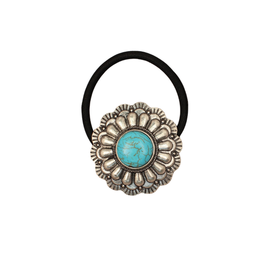 Decorative hair tie with silver floral concho featuring a round turquoise stone, on a white background