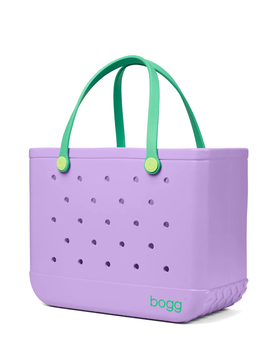 Purple Bogg tote bag with green handles on a white background