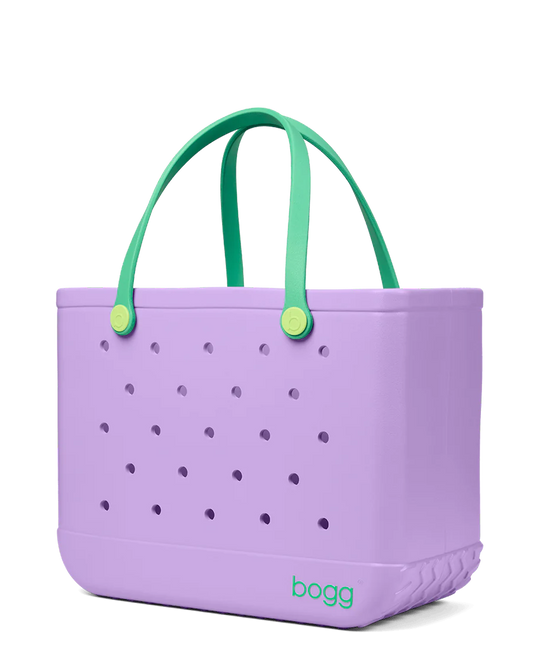 Purple Bogg tote bag with green handles on a white background