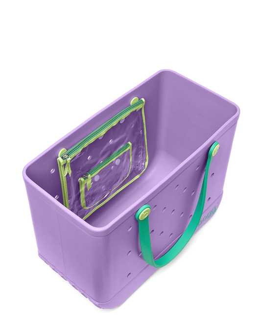 Top view of purple Bogg tote bag with green handles on a white background