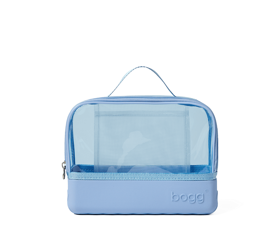 Blue toiletry bag with clear compartment on a white background