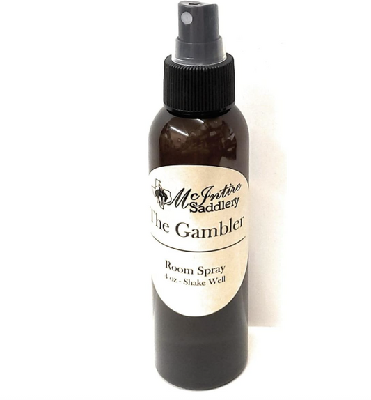Room spray bottle labeled 'The Gambler' from McIntire Saddlery on a white background