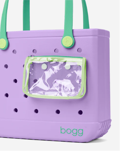 Purple Baby Bogg tote bag with green handles and a clear pocket attached