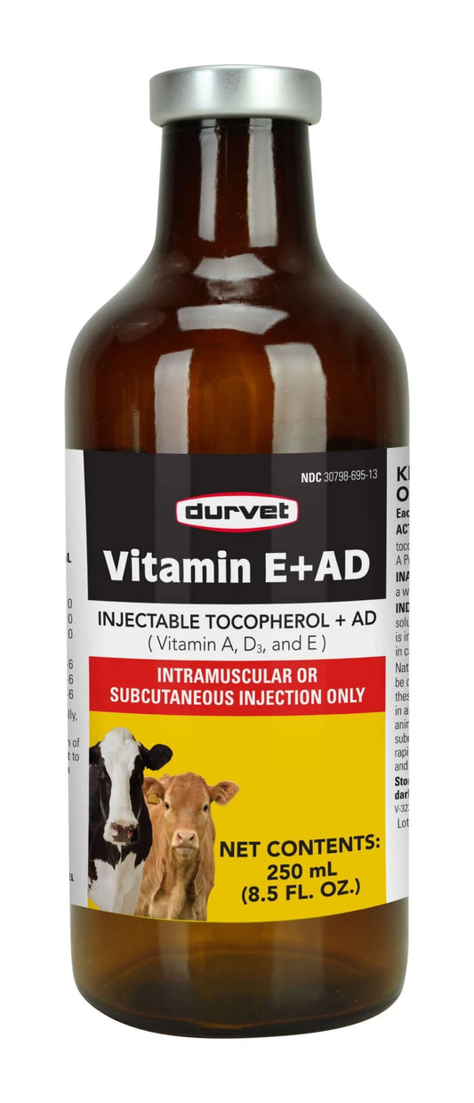 Brown bottle of Durvet Vitamin E+AD with label showing cows.