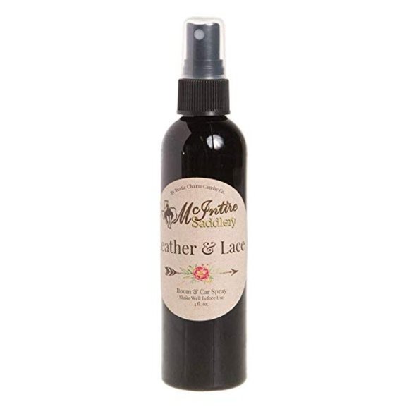Black spray bottle labeled 'McIntire Saddlery Leather & Lace' on a white background