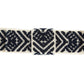 Closeup view of a navy, white, and arrow patterned hatband on a white background