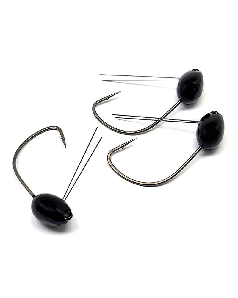 Three black fishing jigs on a white background