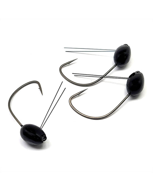 Three black fishing jigs on a white background