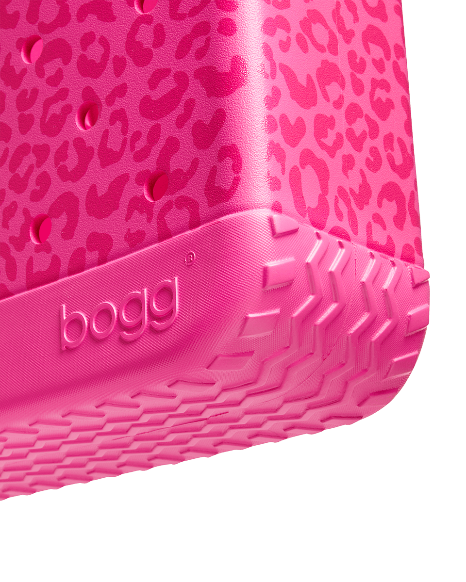 Close-up of the bottom of a pink Baby Bogg with leopard print pattern and 'bogg' branding on a white background