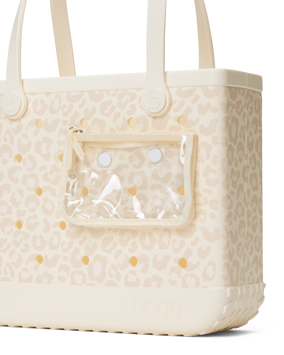 Beige leopard Baby Bogg tote bag with and clear pocket attached on a white background