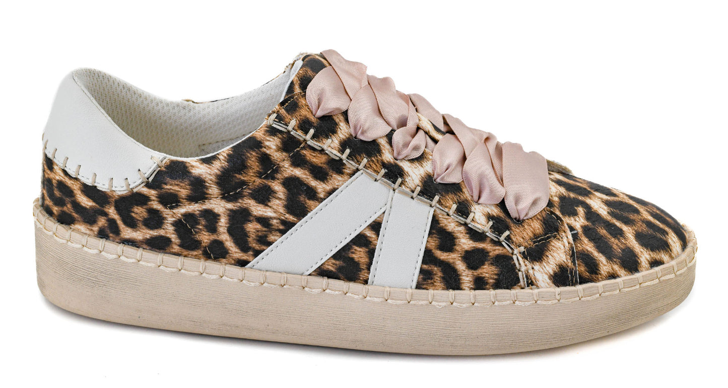 Leopard print sneaker with pink ribbon laces on a white background
