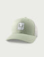 Huk Stacked U Trucker Hat in Seagrass