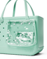 Shimmery seafoam Bogg tote bag with perforated design and clear pocket attached, on a white background