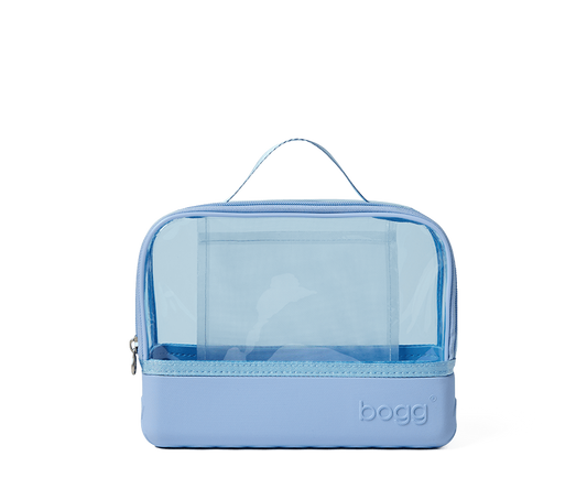 Blue toiletry bag with clear compartment on a white background