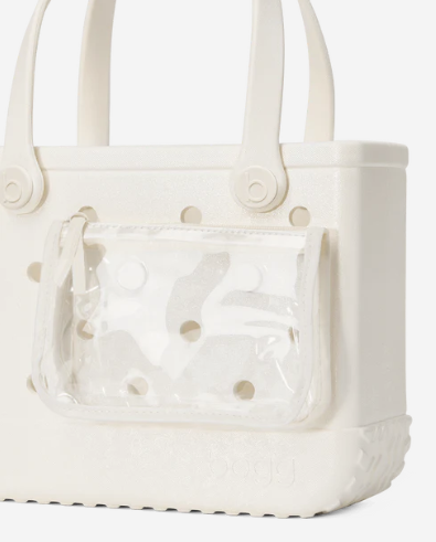 Cream shimmer Bitty Bogg bag with clear pouch attached, on a white background