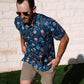 Raised by Coyotes Skulls & Daisies Polo