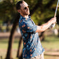 Raised by Coyotes Skulls & Daisies Polo