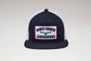 Kimes Ranch LJC Trucker Hat in Navy