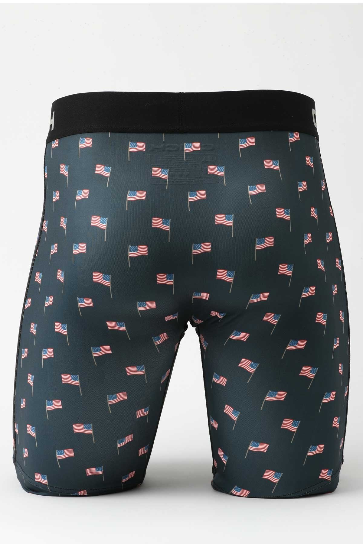Back view of male mannequin bottom wearing navy boxer briefs with US flag print on white background