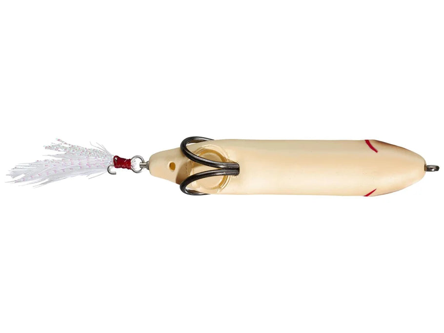 Bottom view of cream-colored fishing lure with a white tail on a white background